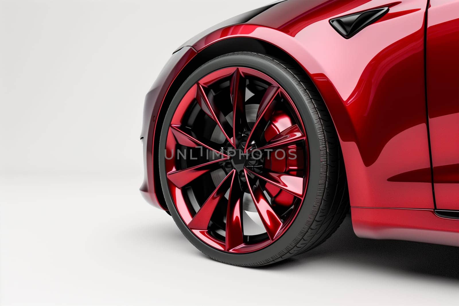 Detailed close-up of a vibrant red car tire on a plain white background, showcasing the texture and design of the tires tread and rims.