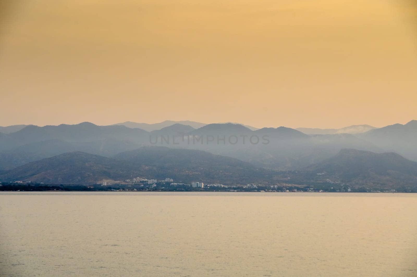 Sunset in Cyprus. The sun sets in the Mediterranean. Evening panorama