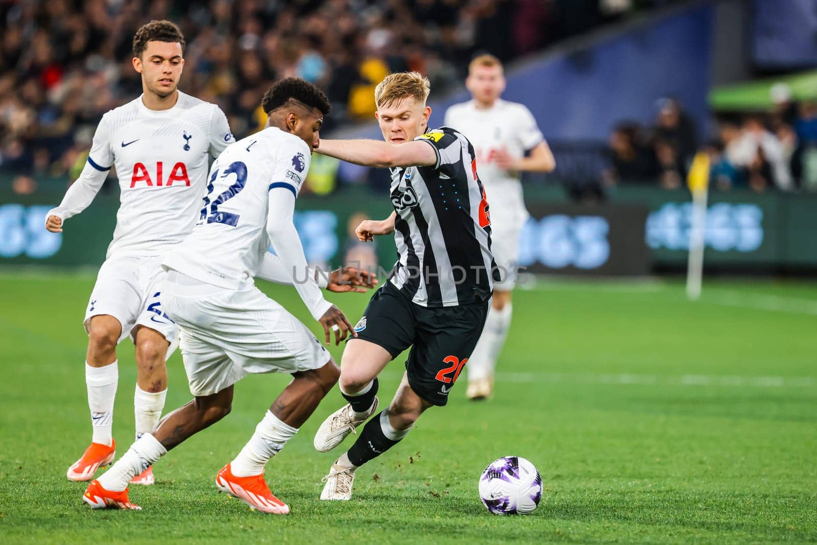 MELBOURNE, AUSTRALIA - MAY 22: Emerson Royal of Tottenham Hotspur and Lewis Hall of Newcastle United tussle for the ball during the Global Football Week at The Melbourne Cricket Ground on May 22, 2024 in Melbourne, Australia