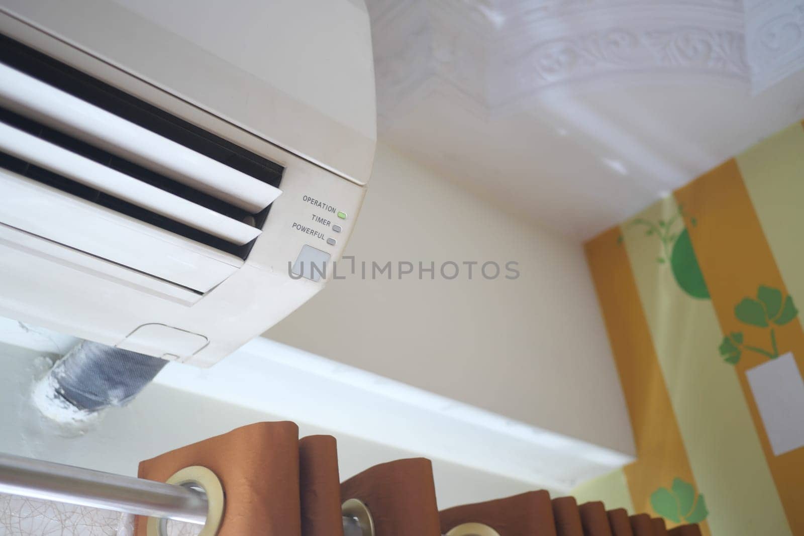 air conditioner on a wall at home .