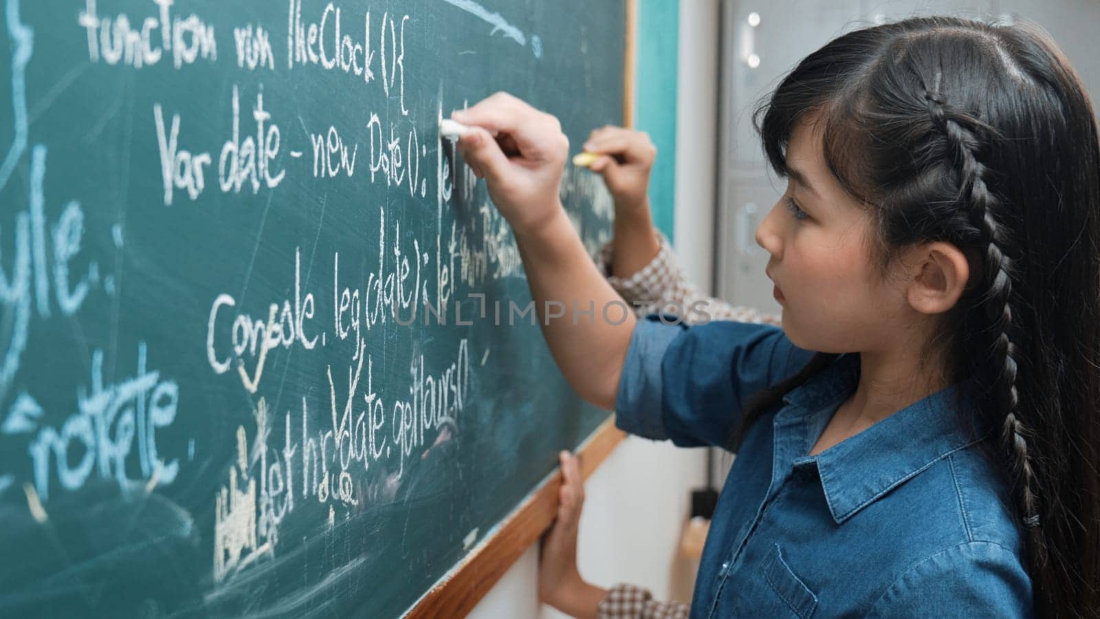 Skilled asian girl writing engineering prompt and programing system while standing blackboard with generated AI prompt written by diverse smart student at STEM technology lesson. Education. Pedagogy.