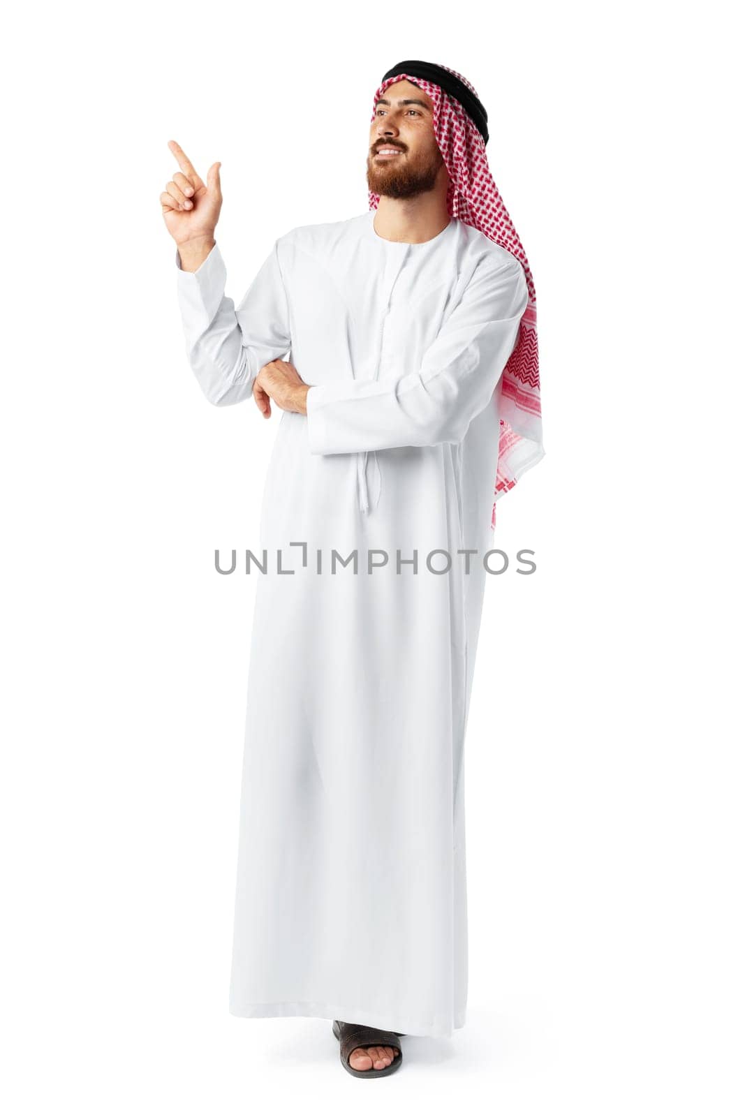 Young Arab man in traditional clothingpointing hand isolated on white background