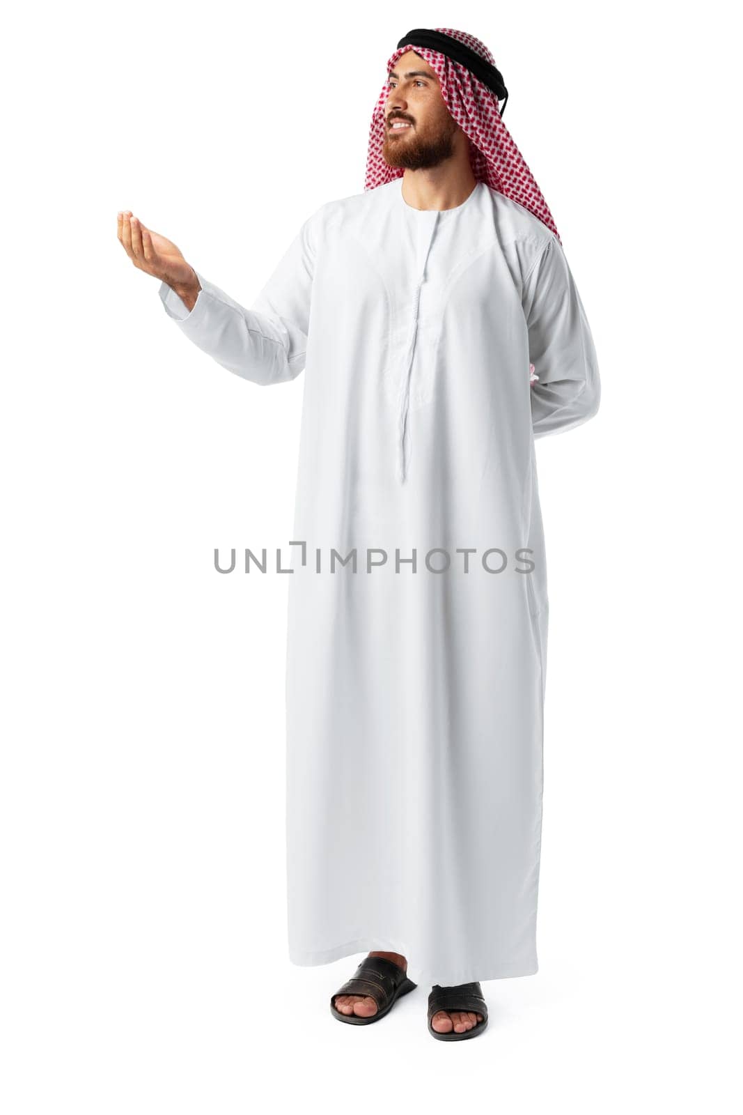 Young Arab man in traditional clothingpointing hand isolated on white background