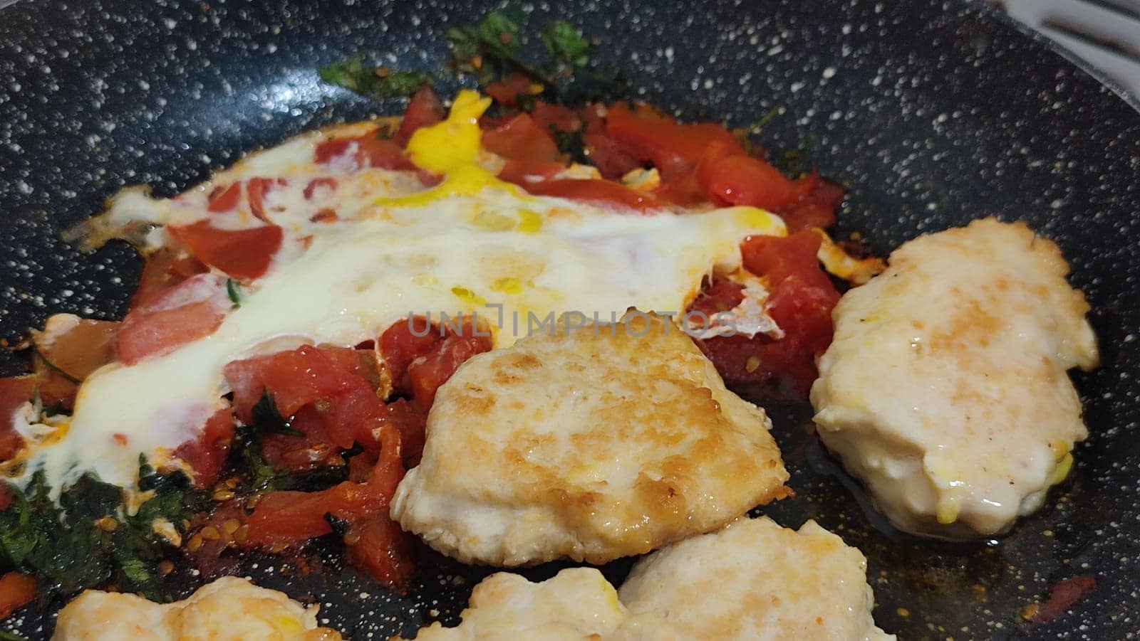 eggs with tomatoes in a frying pan, food, dinner breakfast. High quality photo