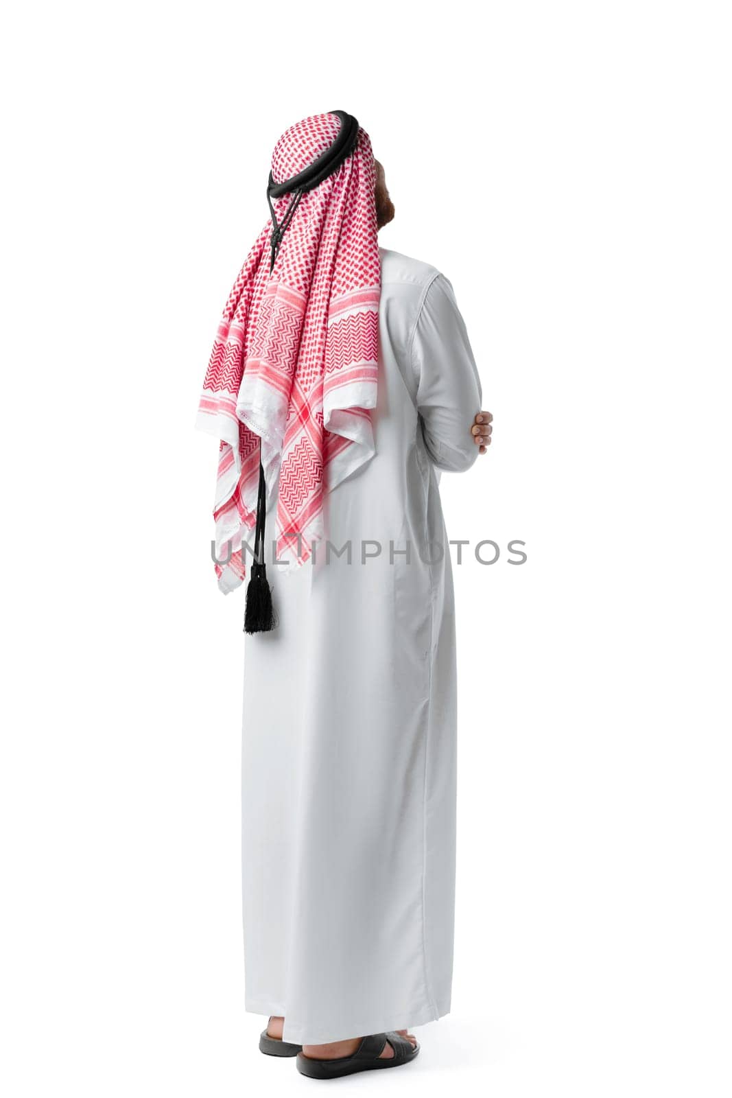 Back view of an Arab man standing on white isolated background close up