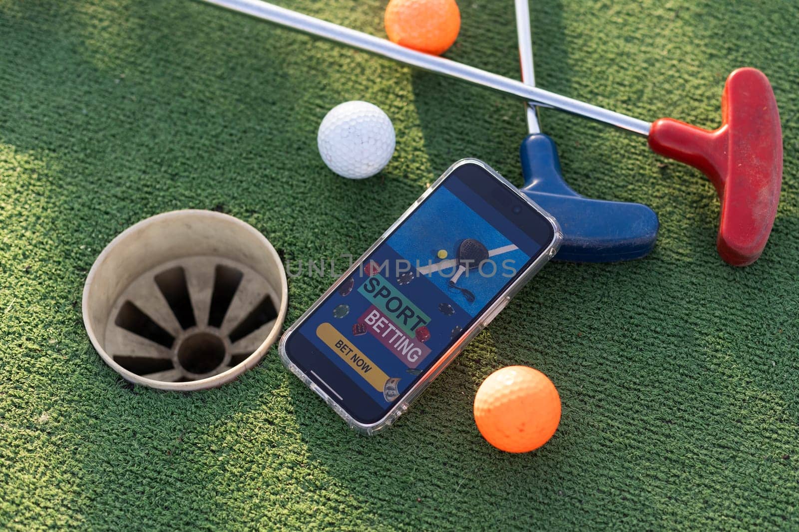 mini golf sports betting on a smartphone. High quality photo