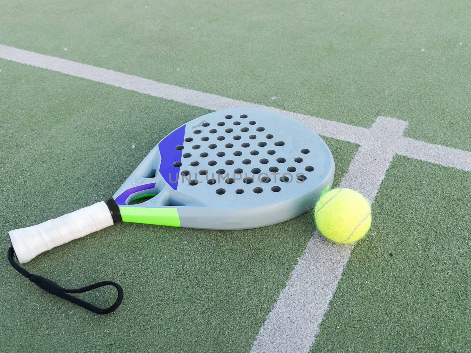 Paddle tennis racket and ball. High quality photo