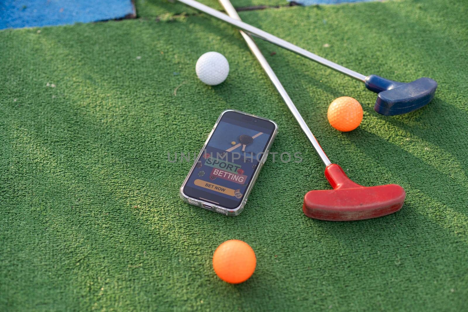 mini golf sports betting on a smartphone. High quality photo