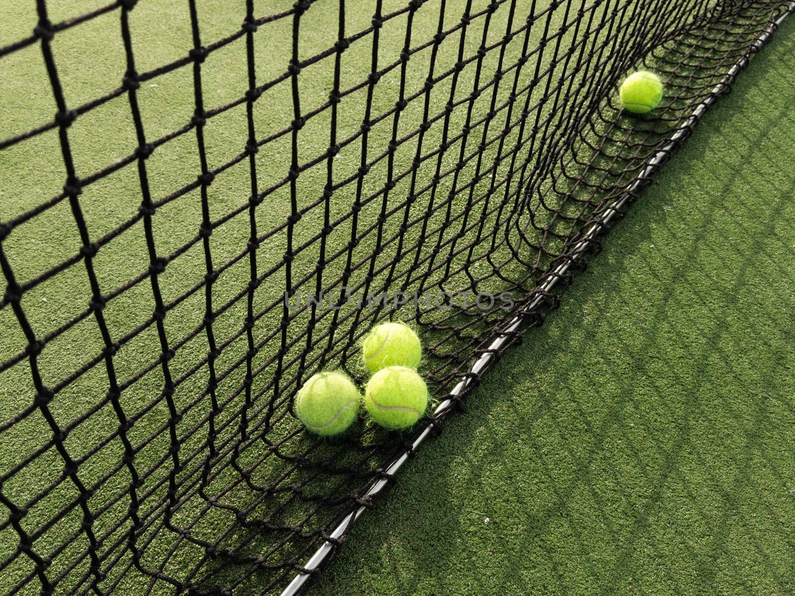 Tennis balls are on green grass. High quality photo