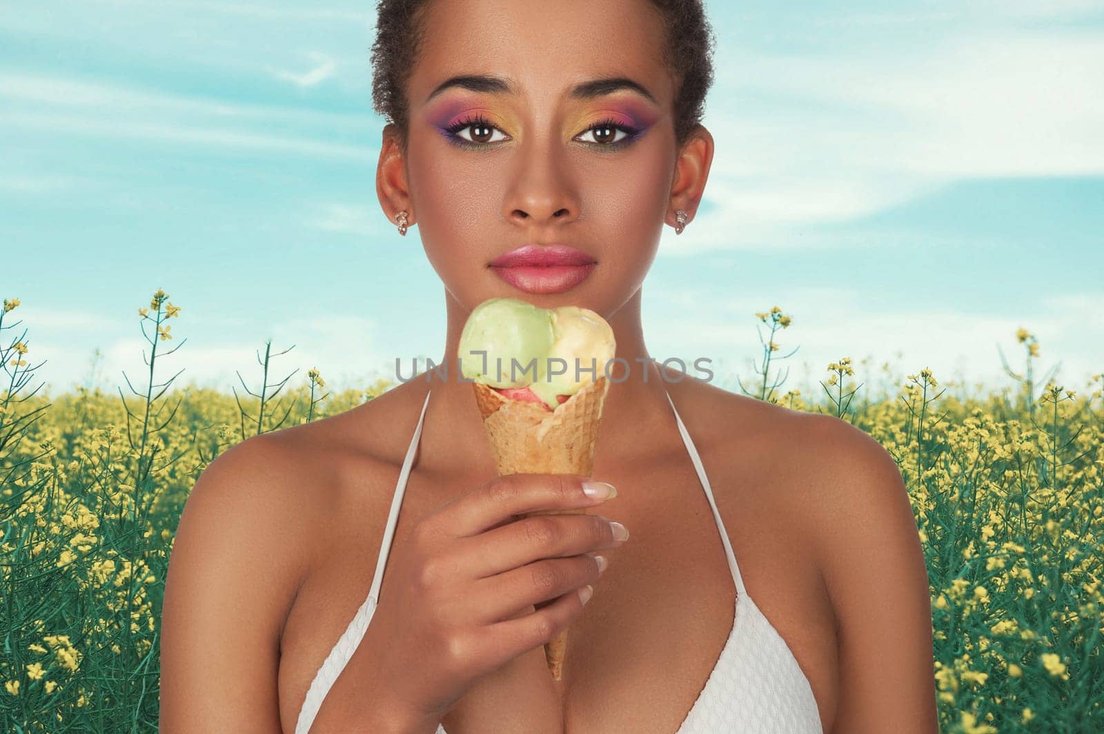 Young african american woman on summer vacation background with ice cream.