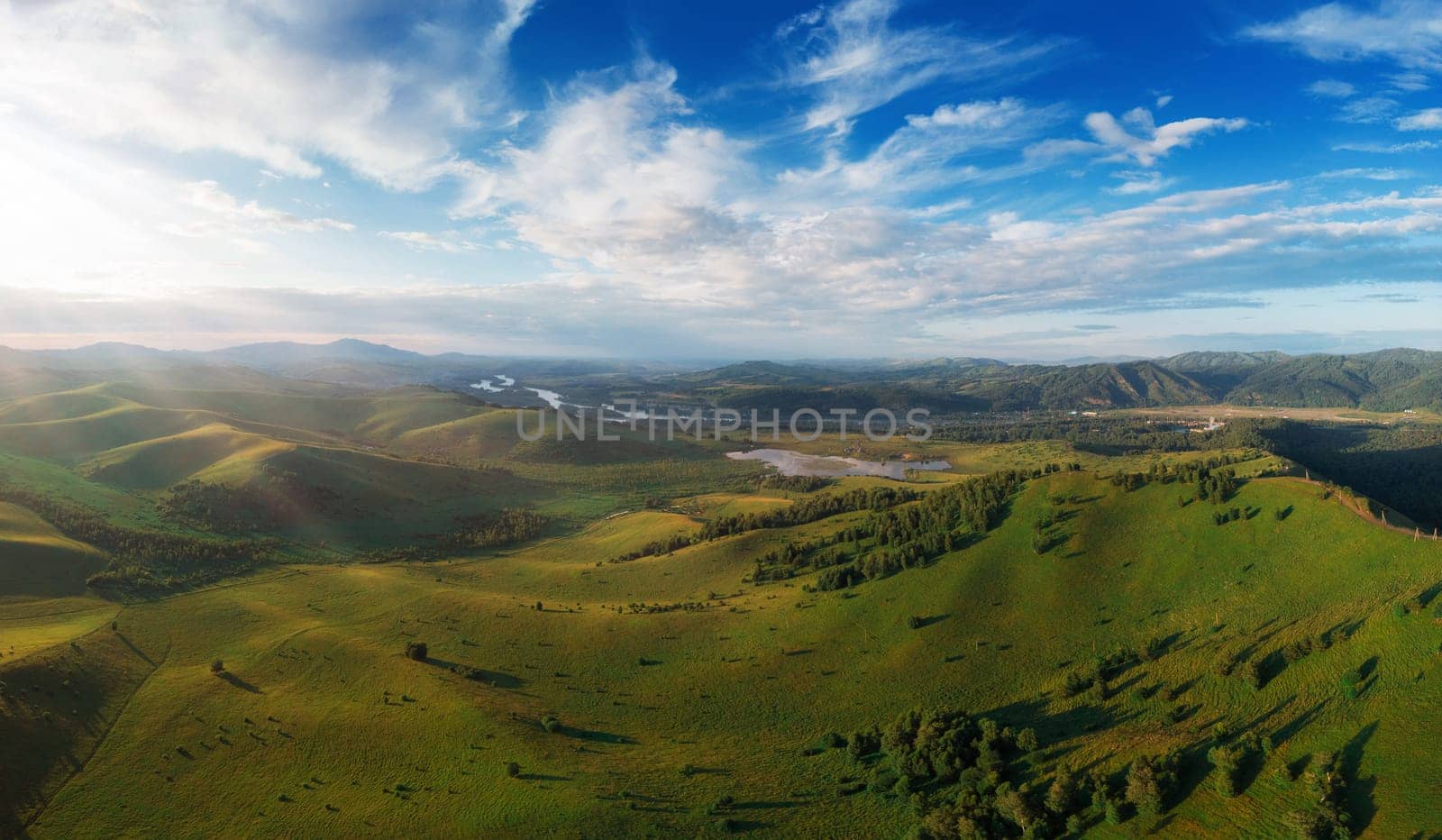 Aerial Panorama drone shot of beauty dawn on the peak, in the mountains in Altay, summertime