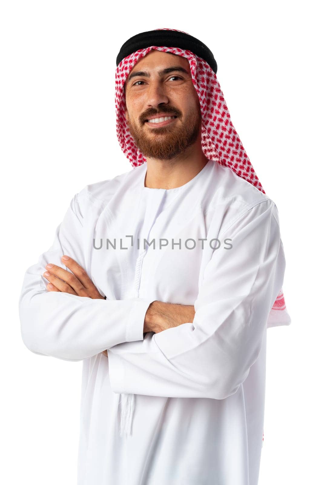 Smiling arab man while standing in an isolated white studio