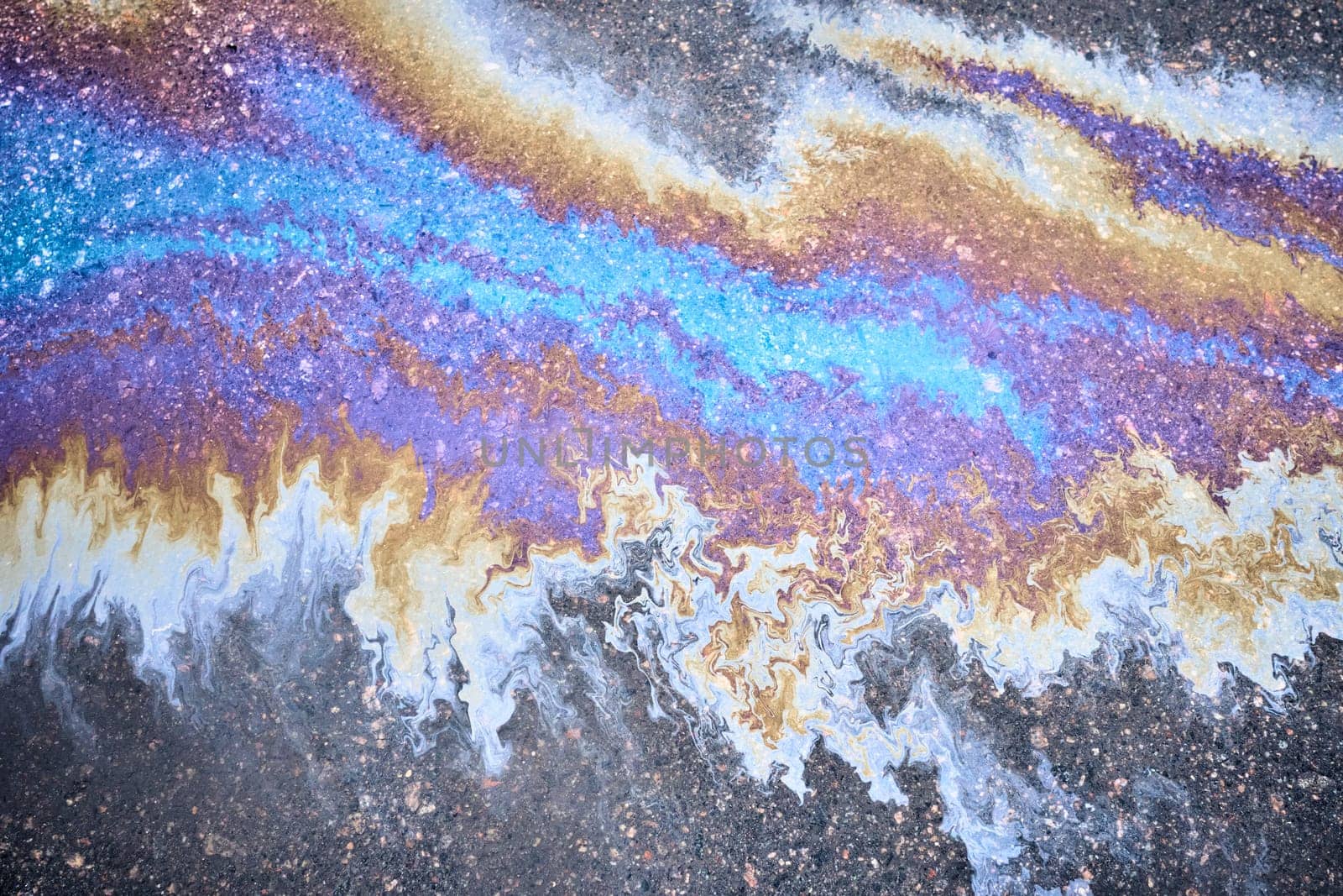 Oil stain, Gas Stain drop from the Car on the Parking Lot Floor.