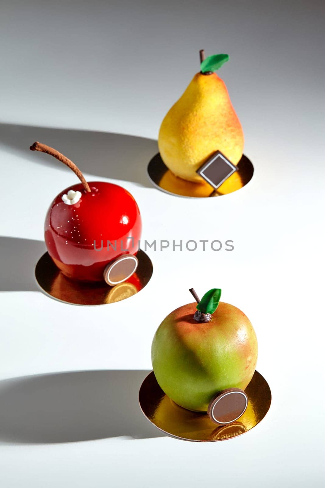 Collection of sweet fruit shaped pastries decorated with chocolate by nazarovsergey