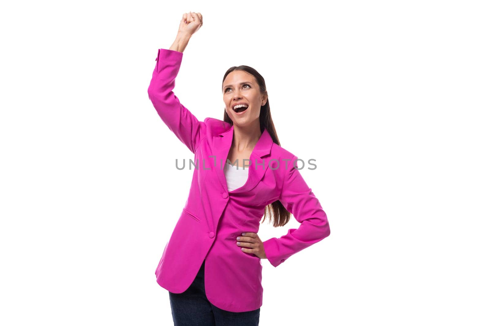 a young slender office worker woman with black hair dressed in a crimson jacket is dancing.