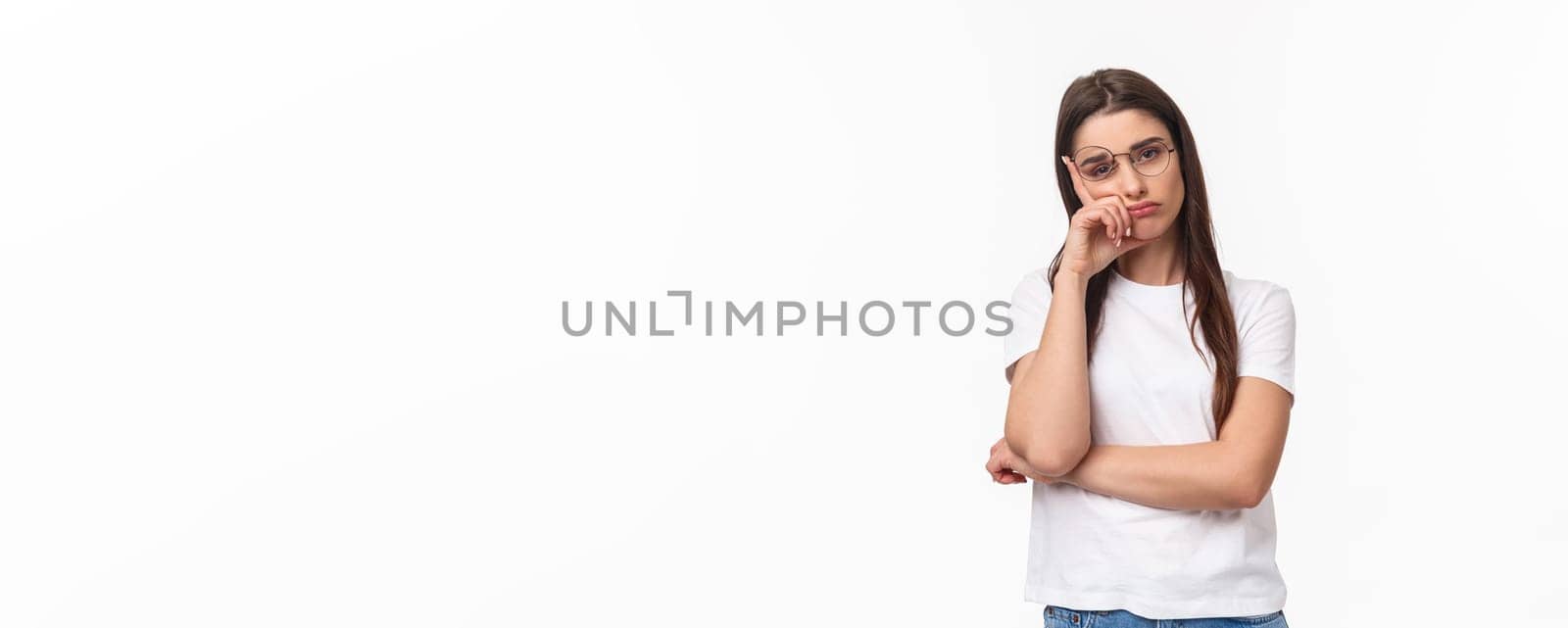 Waist-up portrait of bored, uninterested young brunette female in glasses, feel tired or sleepy, listening to boring conversation, lean on hand look reluctant with lack of interest, white background by Benzoix