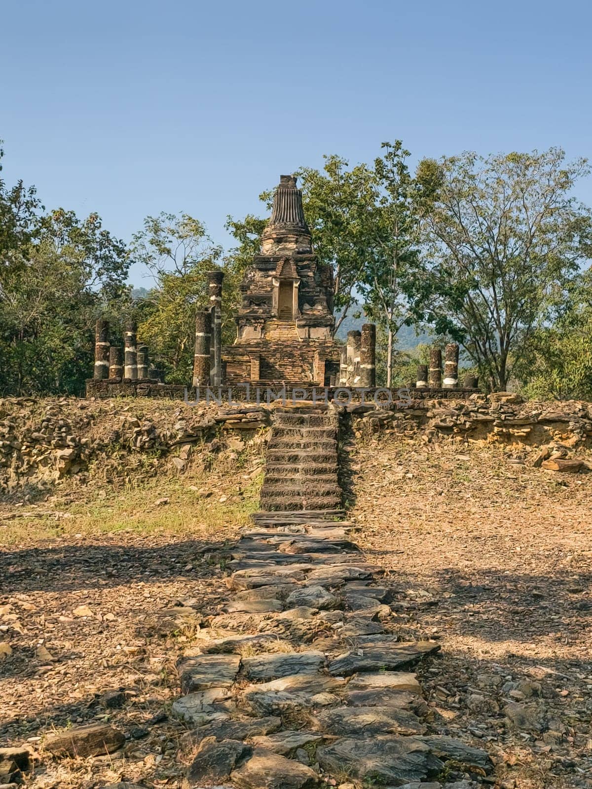 Wat Phra Bat Noi historical temple by day in Sukhothai, Thailand