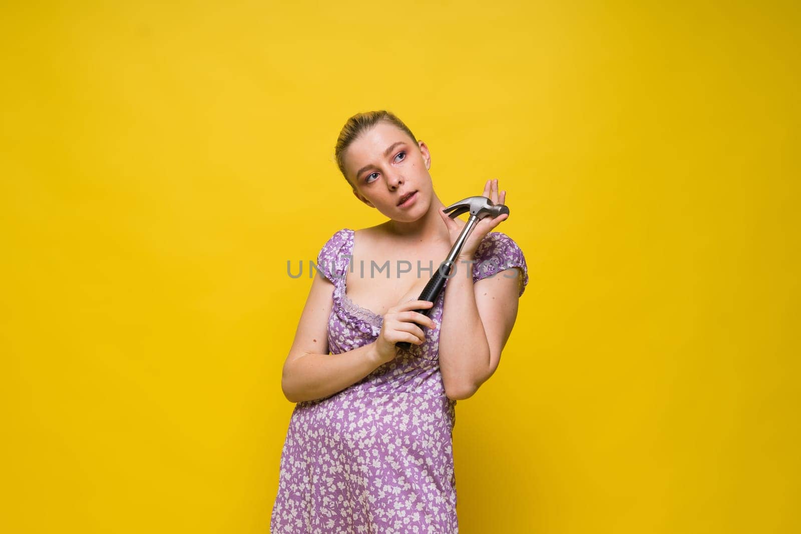 Seductive female handyman is going to fix it all, studio shot by Zelenin