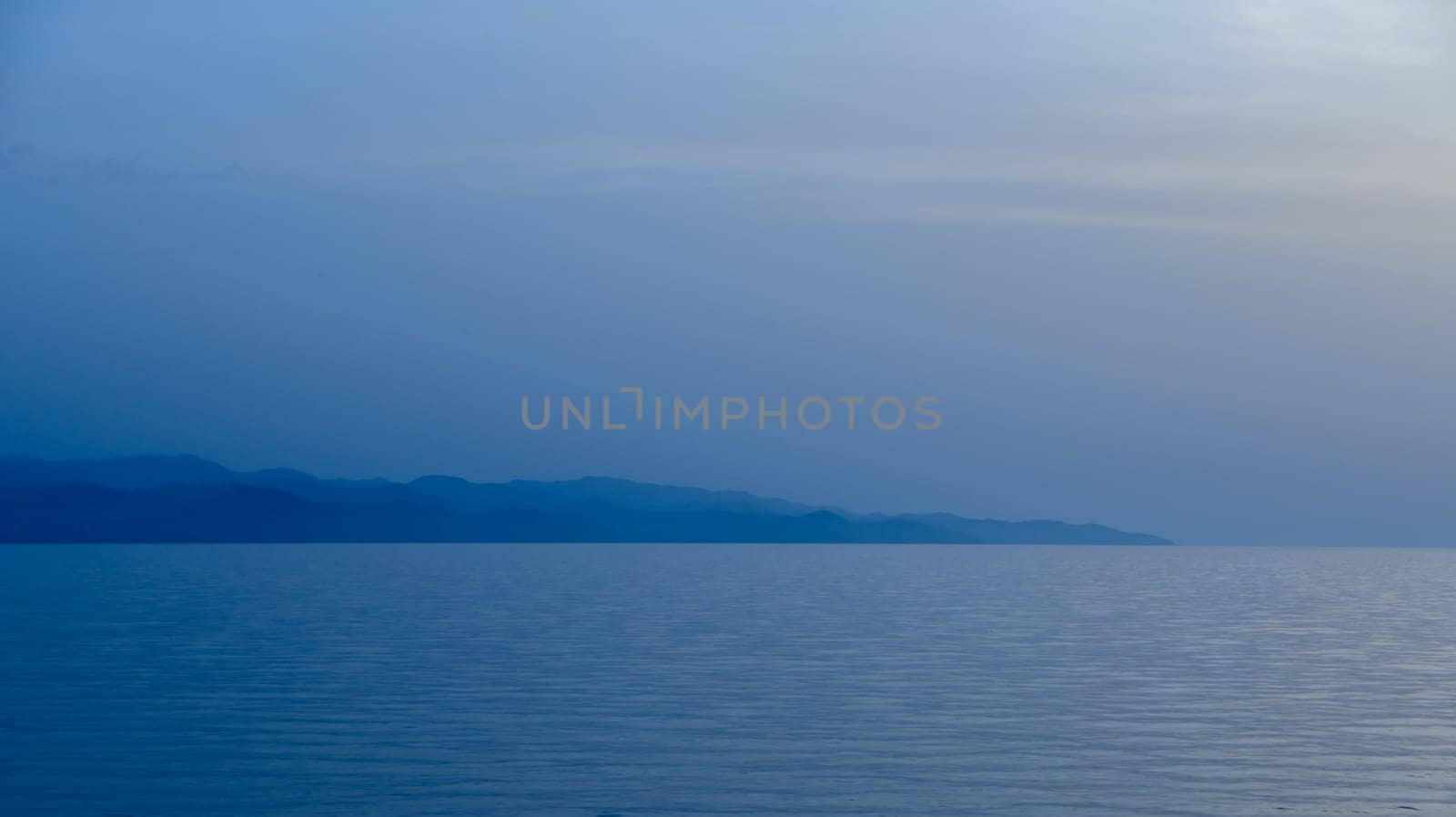 sea ​​view and burning in cyprus after sunset blue hour by Mixa74