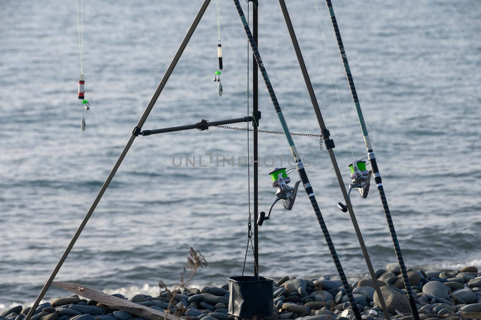 fGazeveren Cyprus -05.18.2024 ishing rods on the seashore by Mixa74