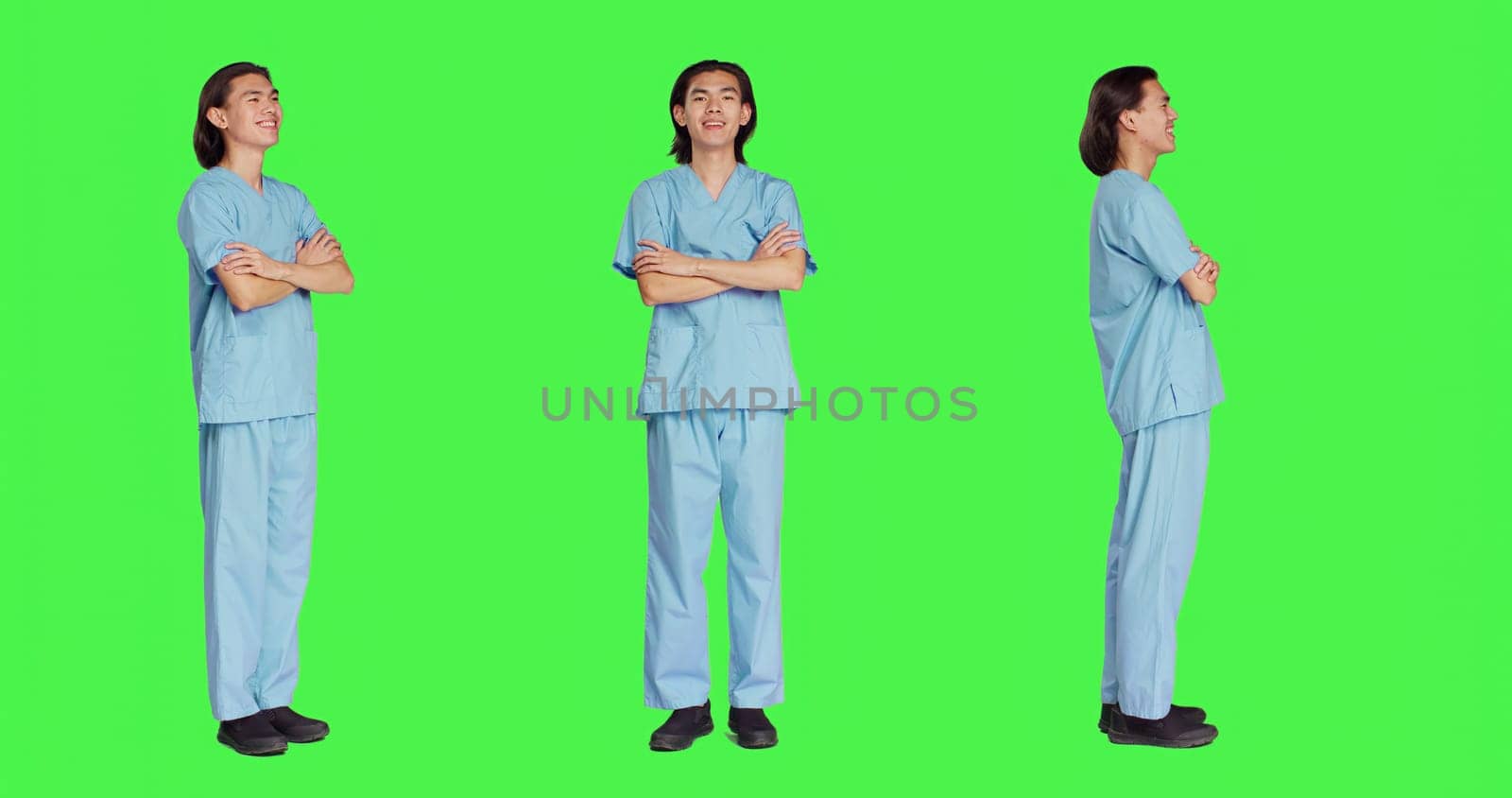 Joyful specialist standing in studio with confidence, wearing clinical clothing and posing with arms crossed over full body greenscreen. Medical assistant in healthcare industry, medicine career.