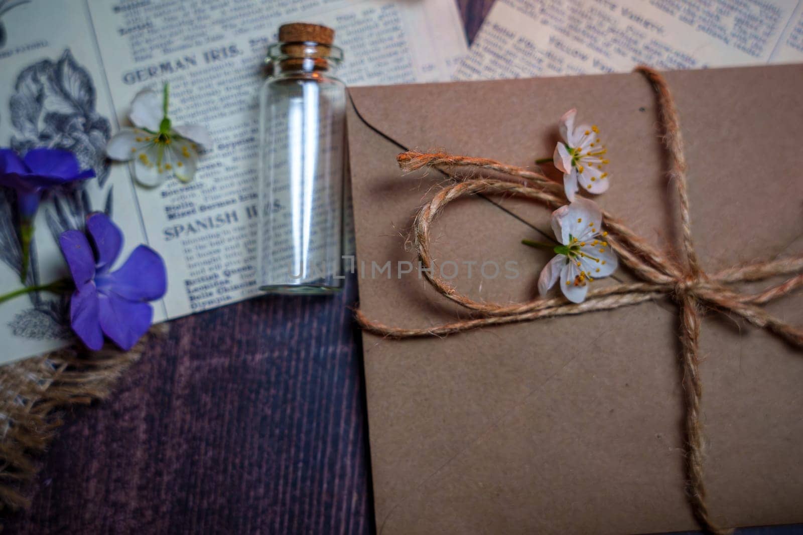 Mystical still life in vintage style with empty flasks, letters and newspaper clippings. High quality photo