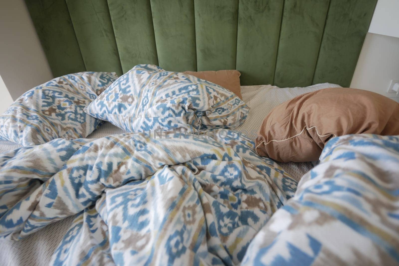 messy bed in early morning , messy bed after waking up .