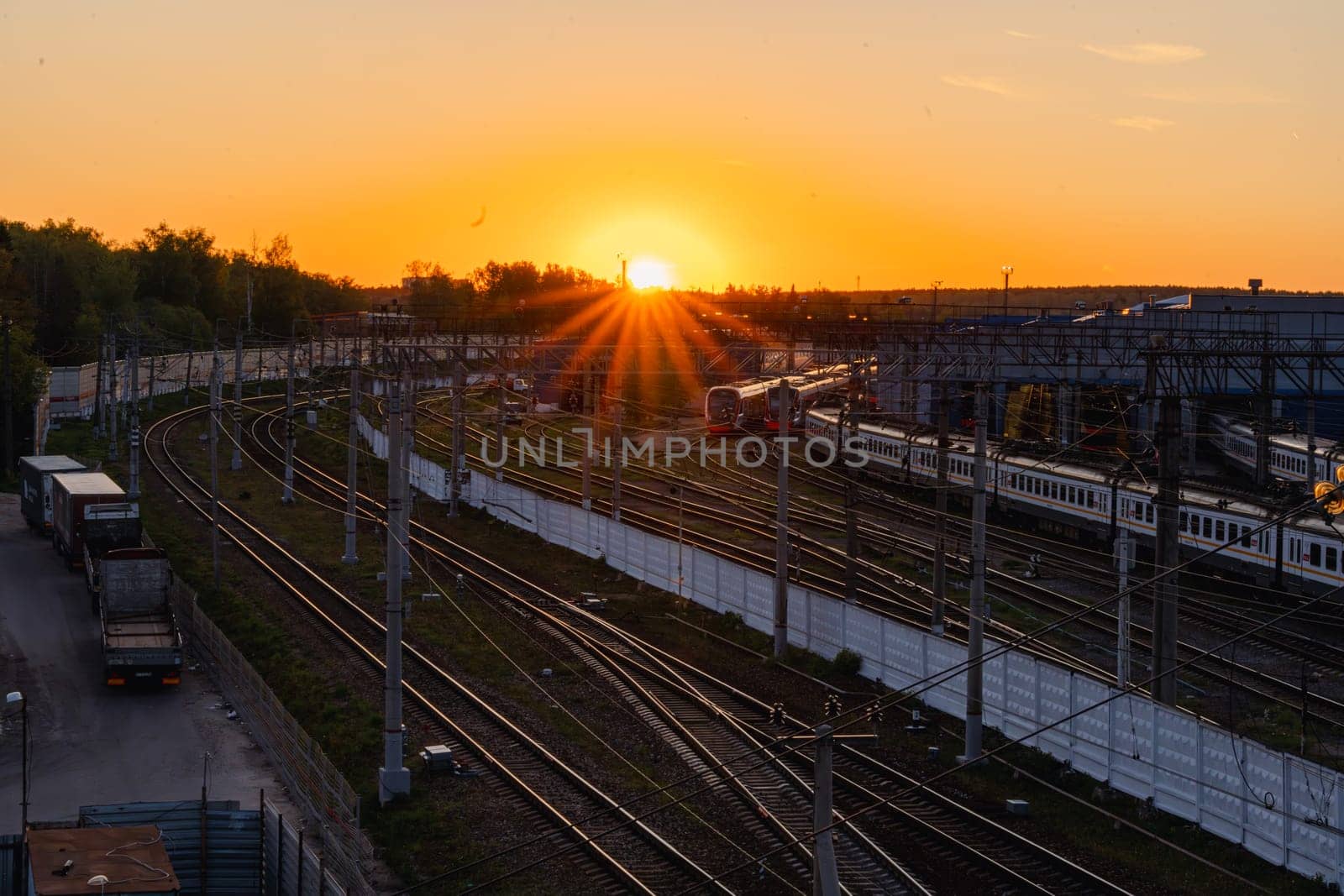 A red sunset over the railway tracks. Urbanism and infrastructure. High quality photo