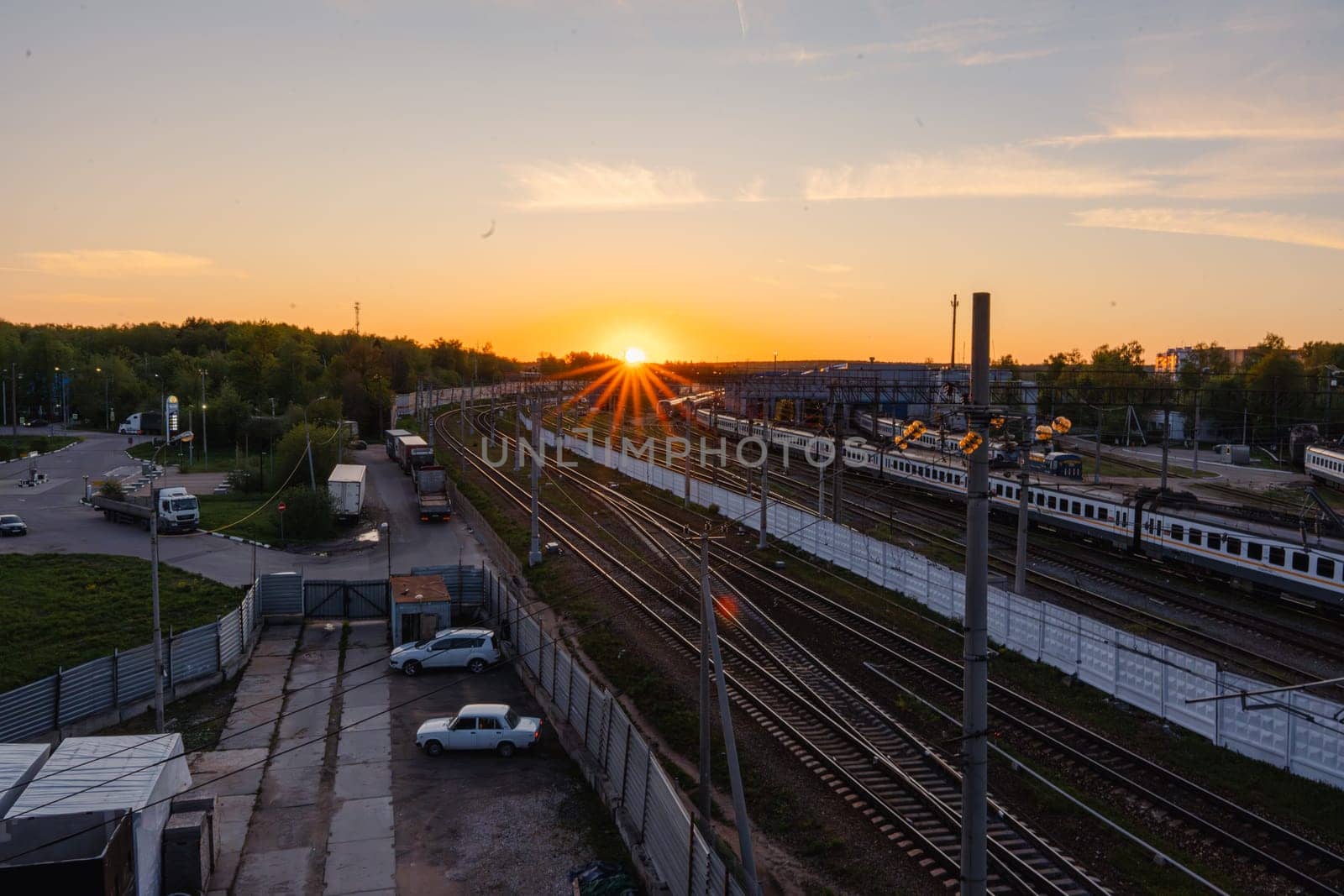 A red sunset over the railway tracks. Urbanism and infrastructure. High quality photo