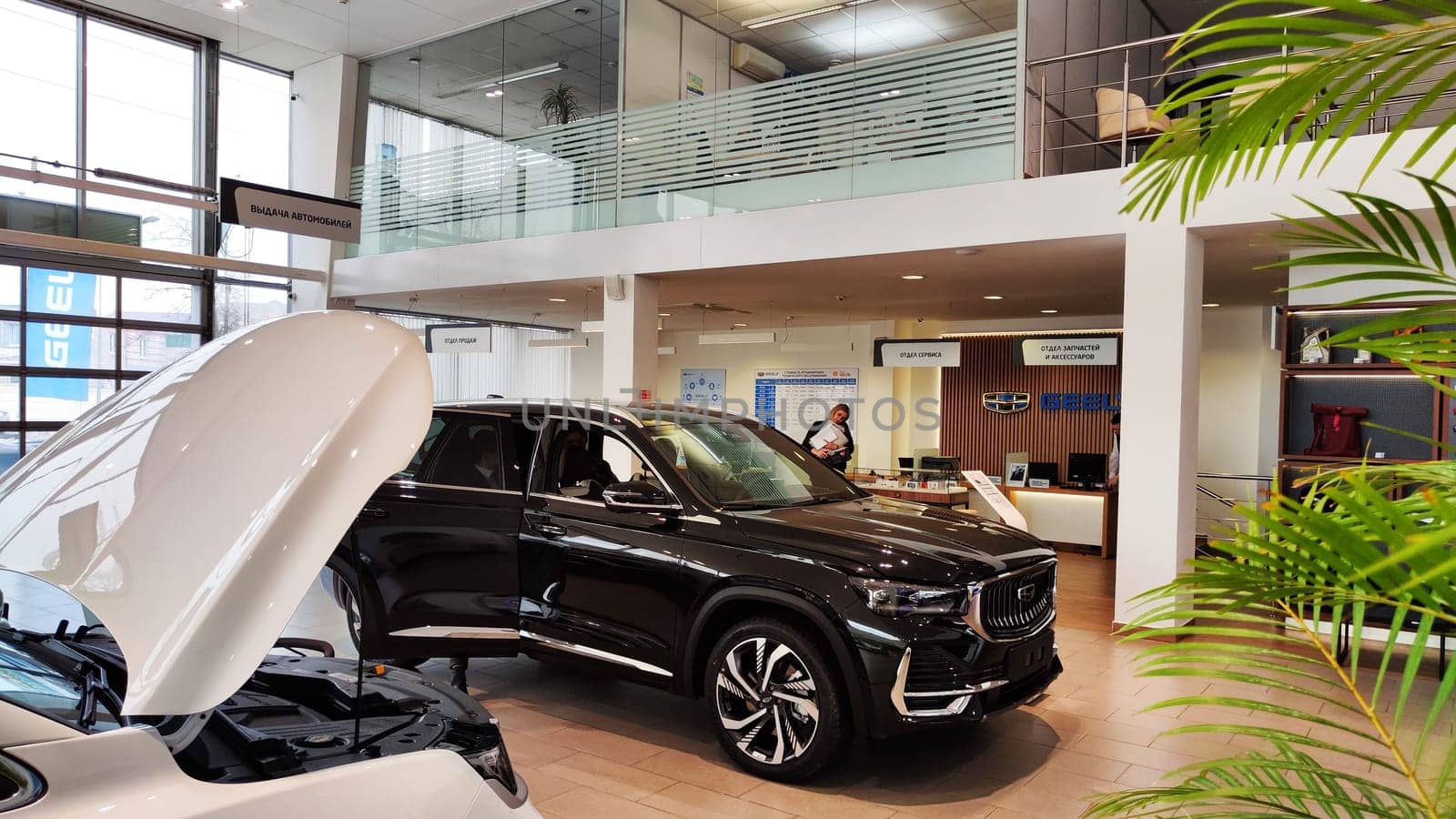 Cheboksary, Russia - March 20, 2023: Cars in showroom of dealership Chinese Car Manufacturer Geely. Sales Salon