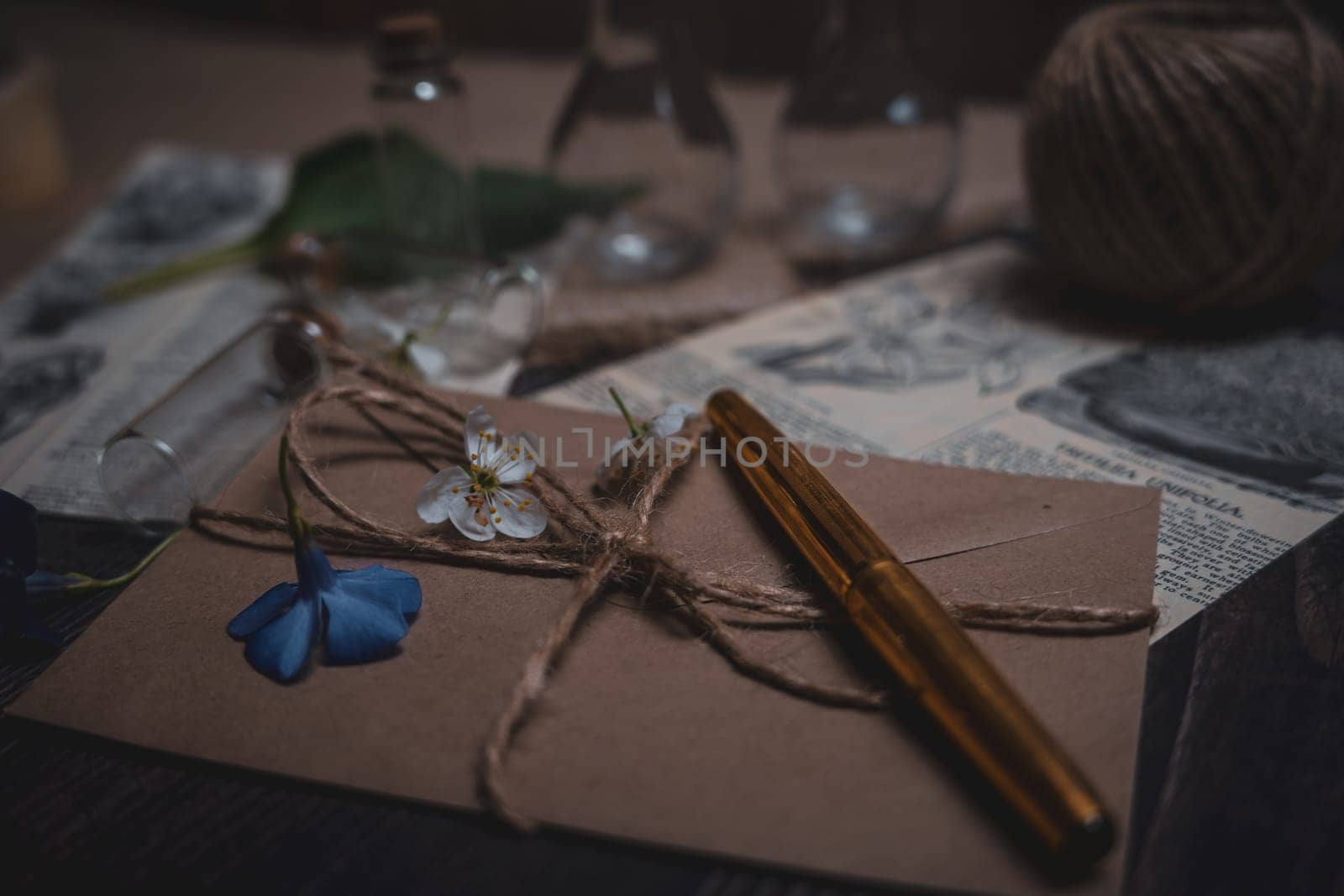 Mystical still life in vintage style with empty flasks, letters and newspaper clippings. High quality photo