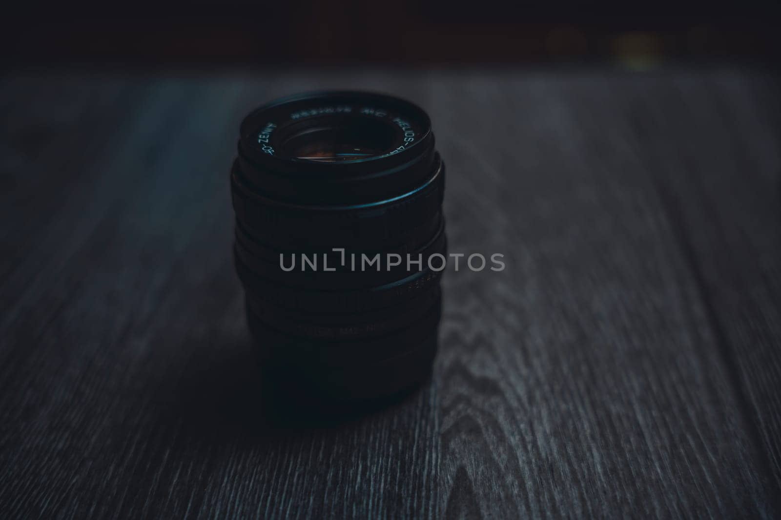 Classic Helios 44-7 lens on a wooden table . High quality photo