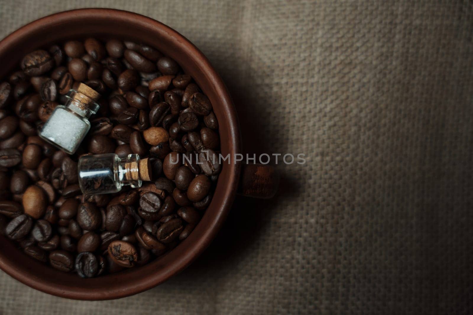 Coffee beans in a clay mug. High quality photo