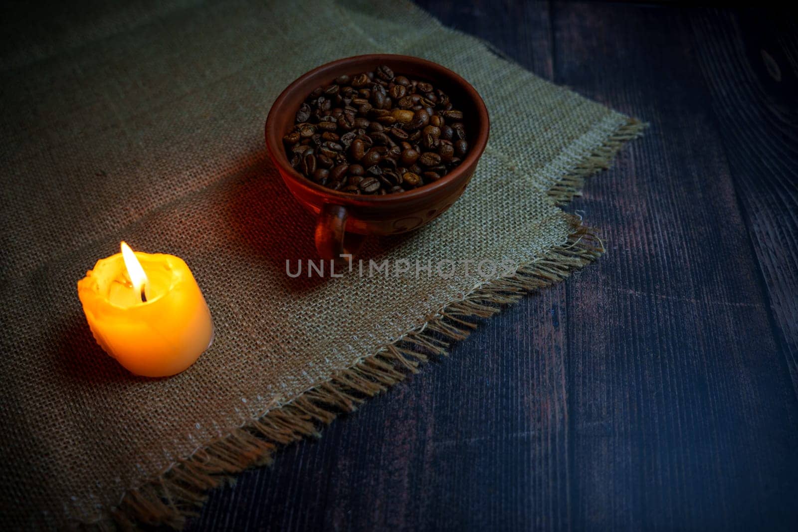 Coffee beans in a clay mug. High quality photo