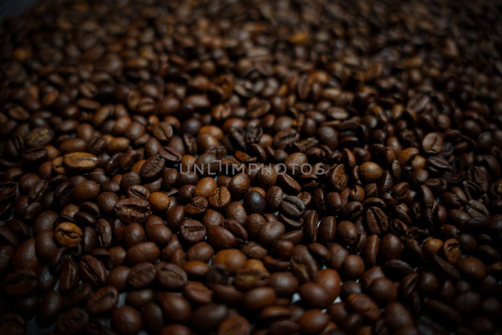 Colorful background with coffee beans in close-up. High quality photo