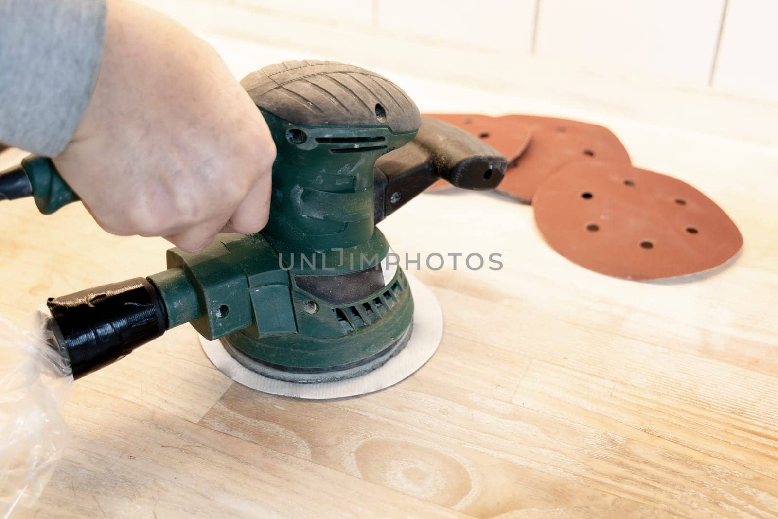Work with a grinder on wood. Work tool. High quality photo