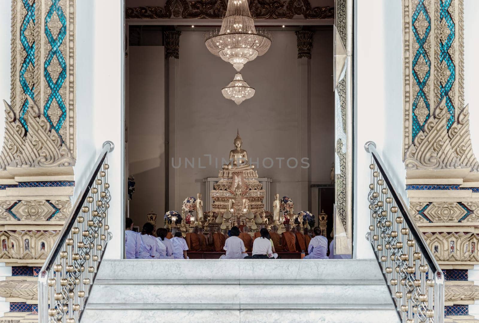 Bangkok, Thailand - May 22, 2024 - Thai women wear white clothes, doing the meditation. Buddha Monks are praying inside the monastery at Samphanthawong Saram Worawihan temple (Wat Ko). Space for text, Selective focus.