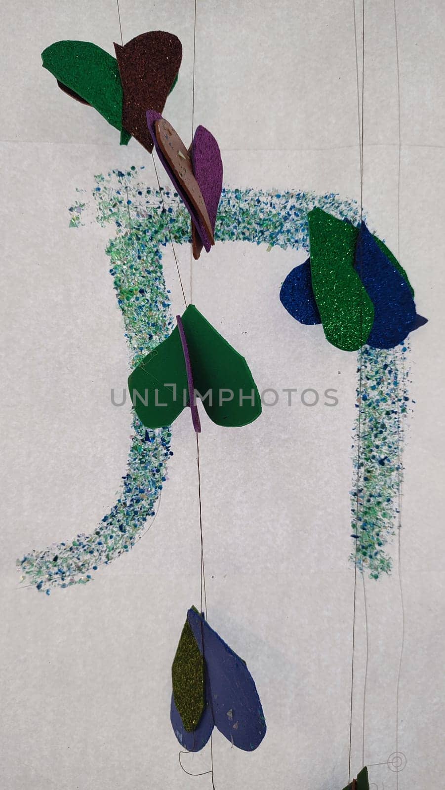 paper green leaves, garland on a white background, summer decorations design by Ply