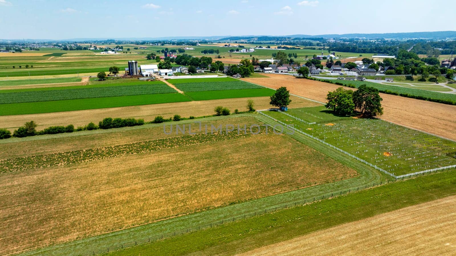 An Aerial View of Agricultural Fields and Rural Community