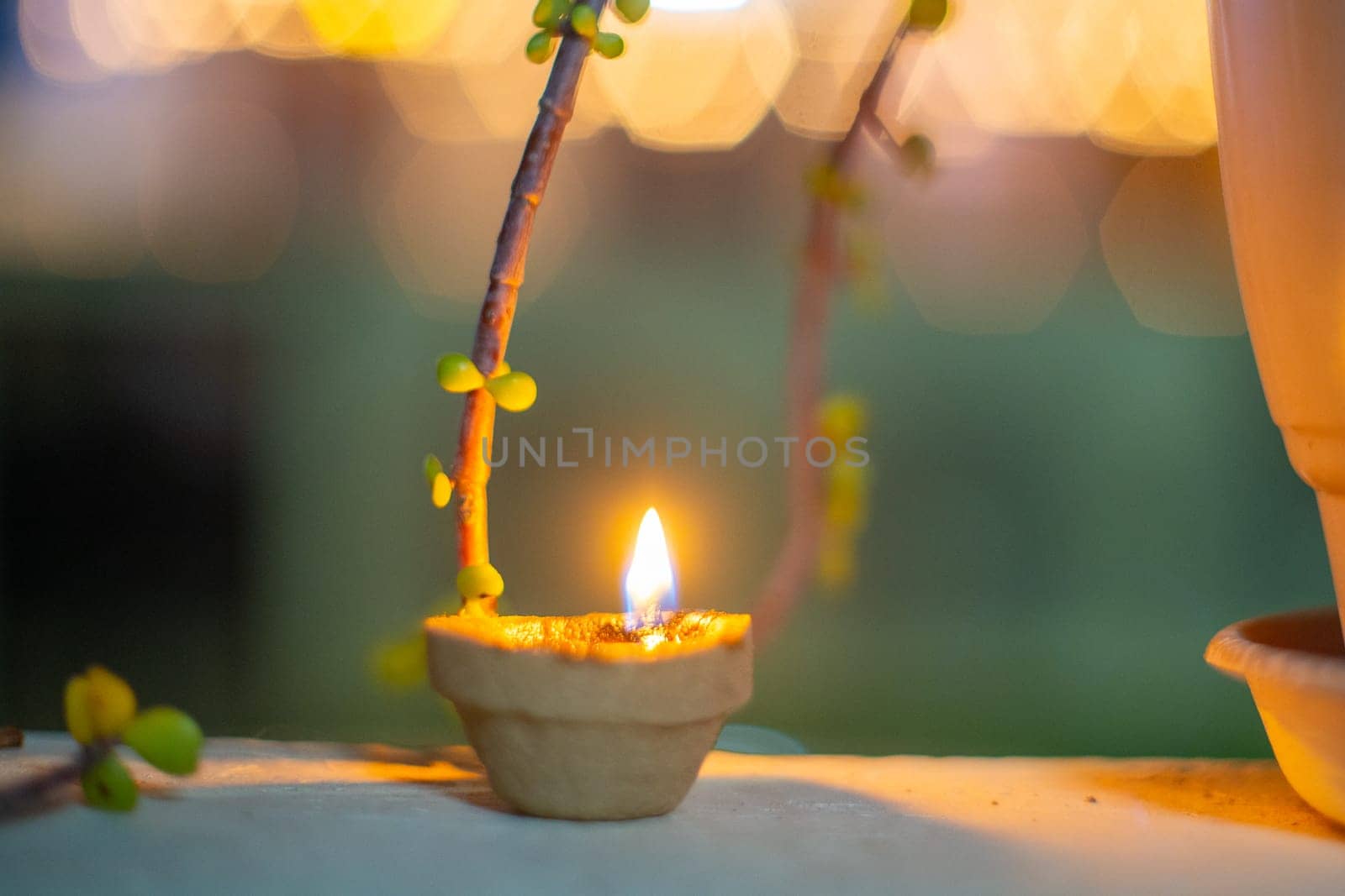 Organic diya lamp made of organic coconut fiber filled with oil and lit to provide light and as an offering to the hindu gods on the festival of diwali India