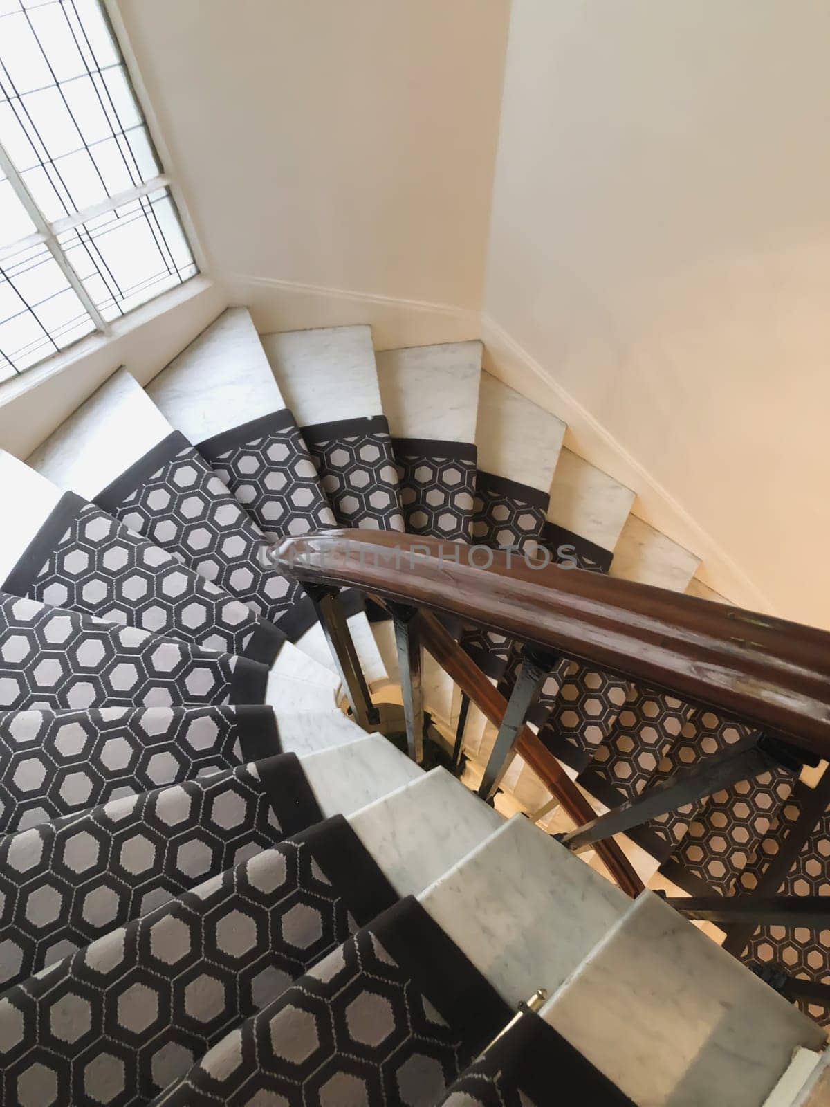 Vintage carpet on a swirling staircase in an apartment in Paris France