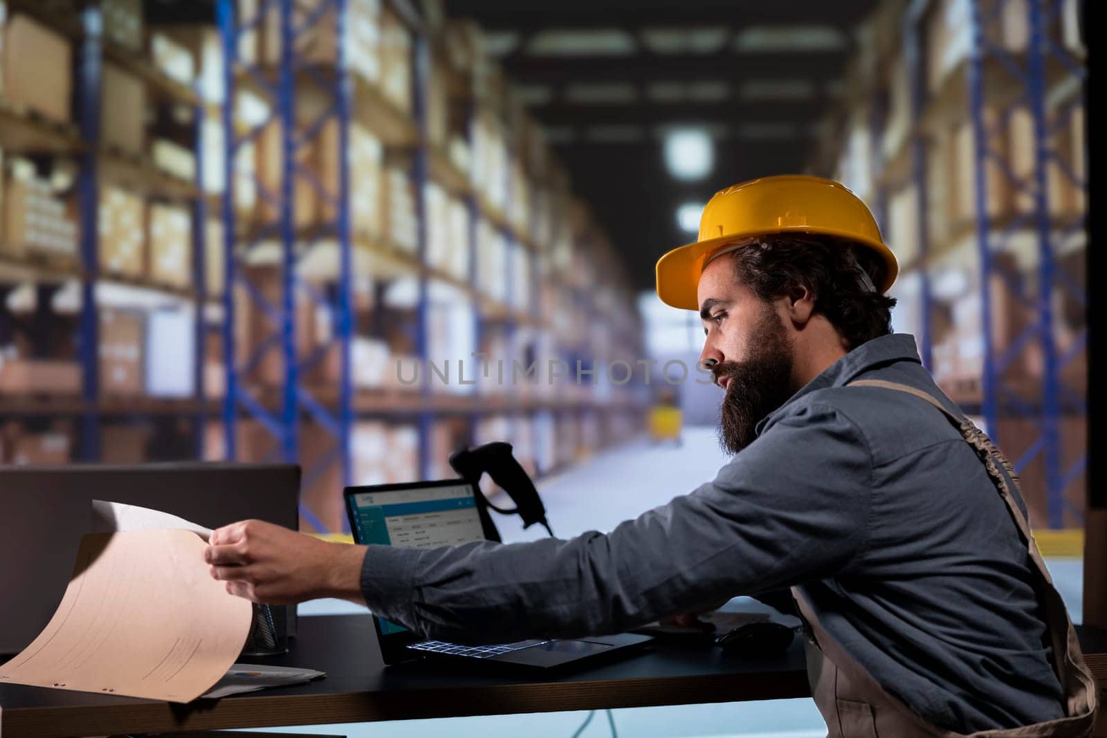Inventory engineer uses barcode reader to verify products and orders, working on distribution and shipment. Customs compliance employee scanning merchandise tags and labels at warehouse.