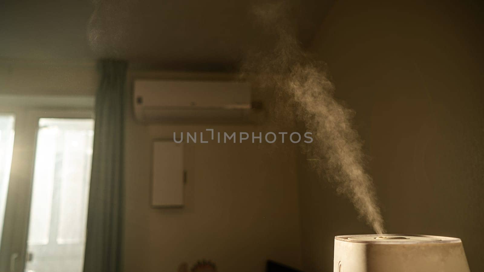 A humidifier evaporates moisture in the bedroom