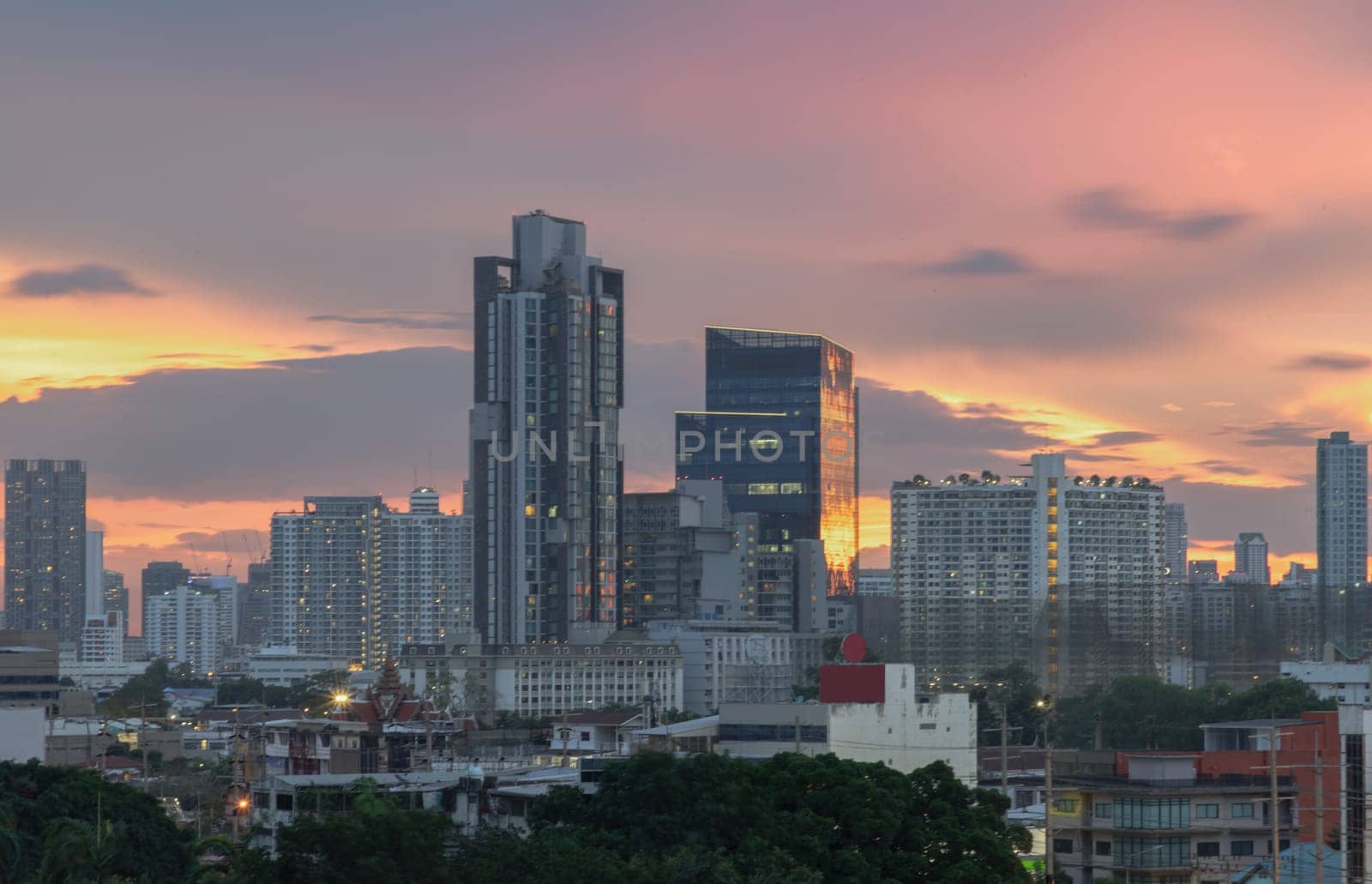 Bangkok, Thailand - May 20, 2024 - Bangkok city skyscrapers after sunset with Beautiful sky background. Gorgeous scenic of sunset with beautiful cloud and sky over metropolitan city, They can be used as Wallpaper, Space for text, Selective Focus.