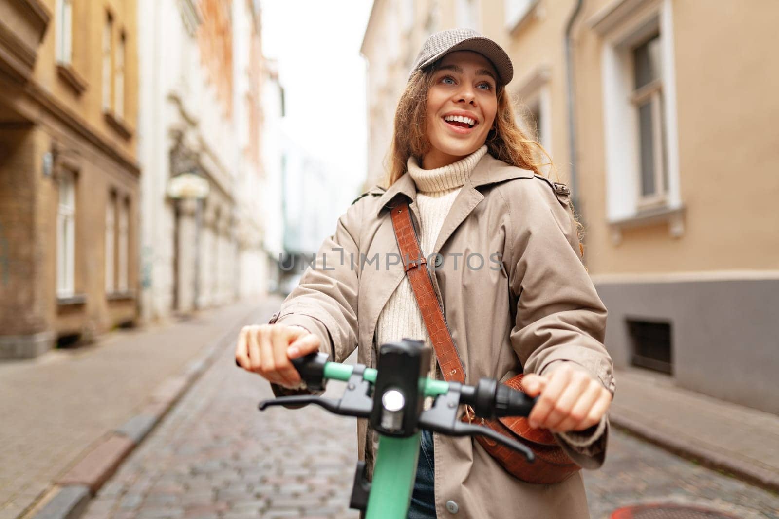 Close up portrait of young woman with electric scooter at the city street