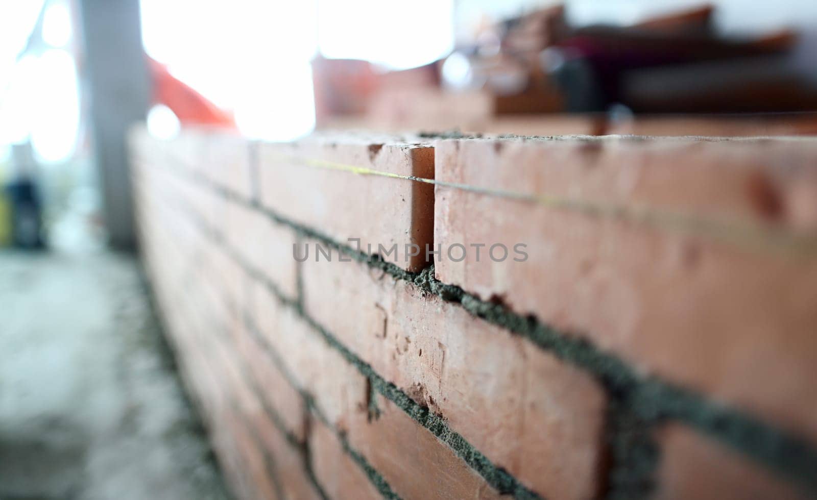 Bricklaying wall apartment repair background. Block house renovation concept.