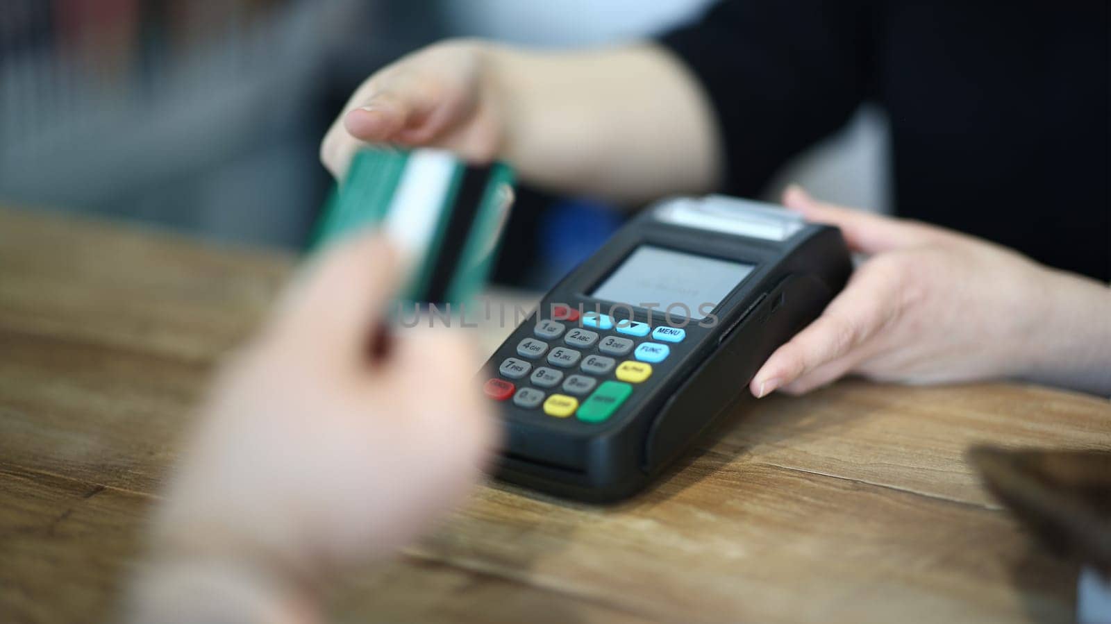 Cashier Hand Taking Plastic Credit Card to Payment. Electronic Money Transaction via Bank Terminal. Commerce Machine for Online Financial Operation. Using Technology Device Close-up Photography