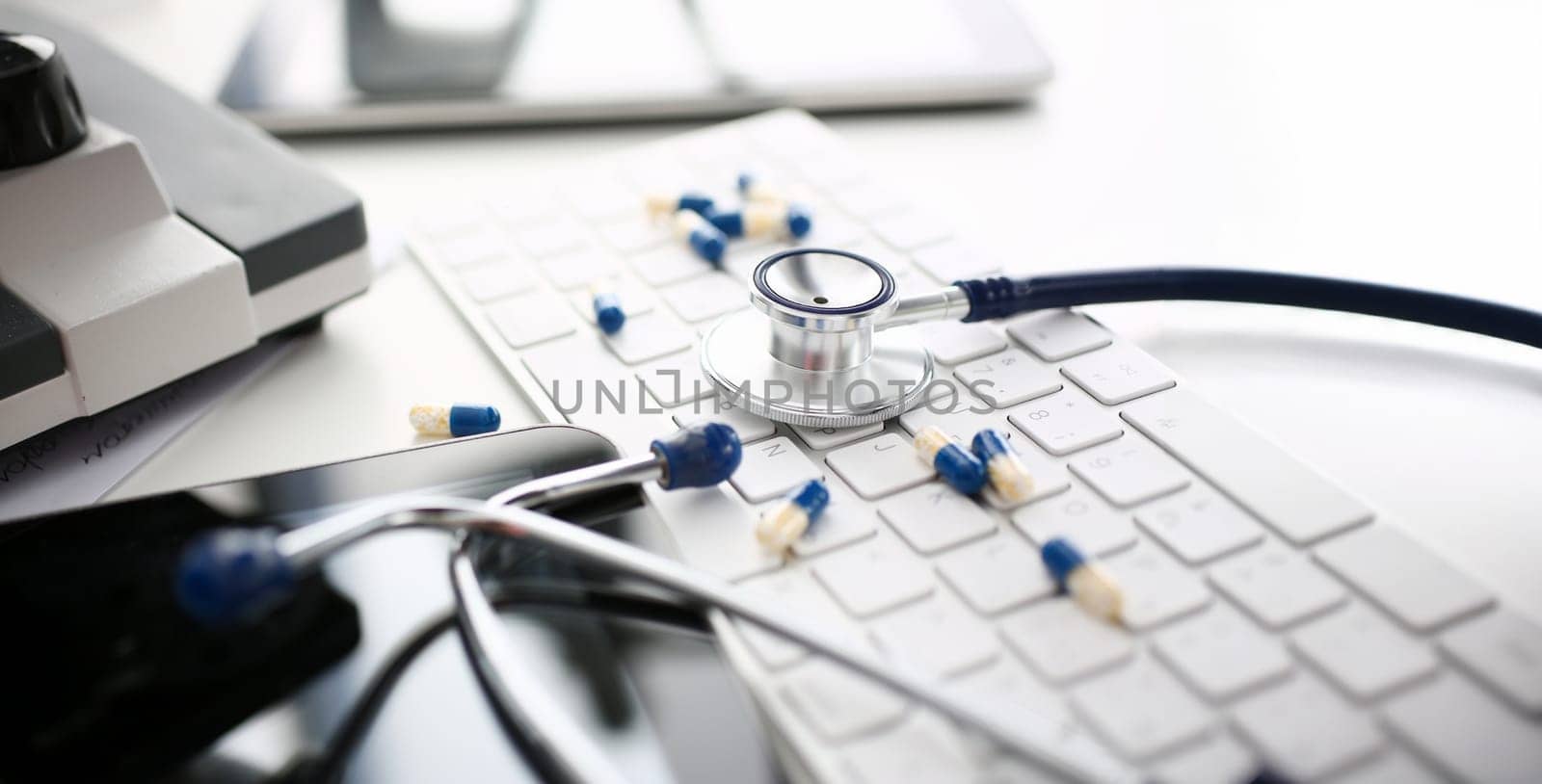 Stethoscope and Pharmaceutical Pill Lying Keyboard by kuprevich