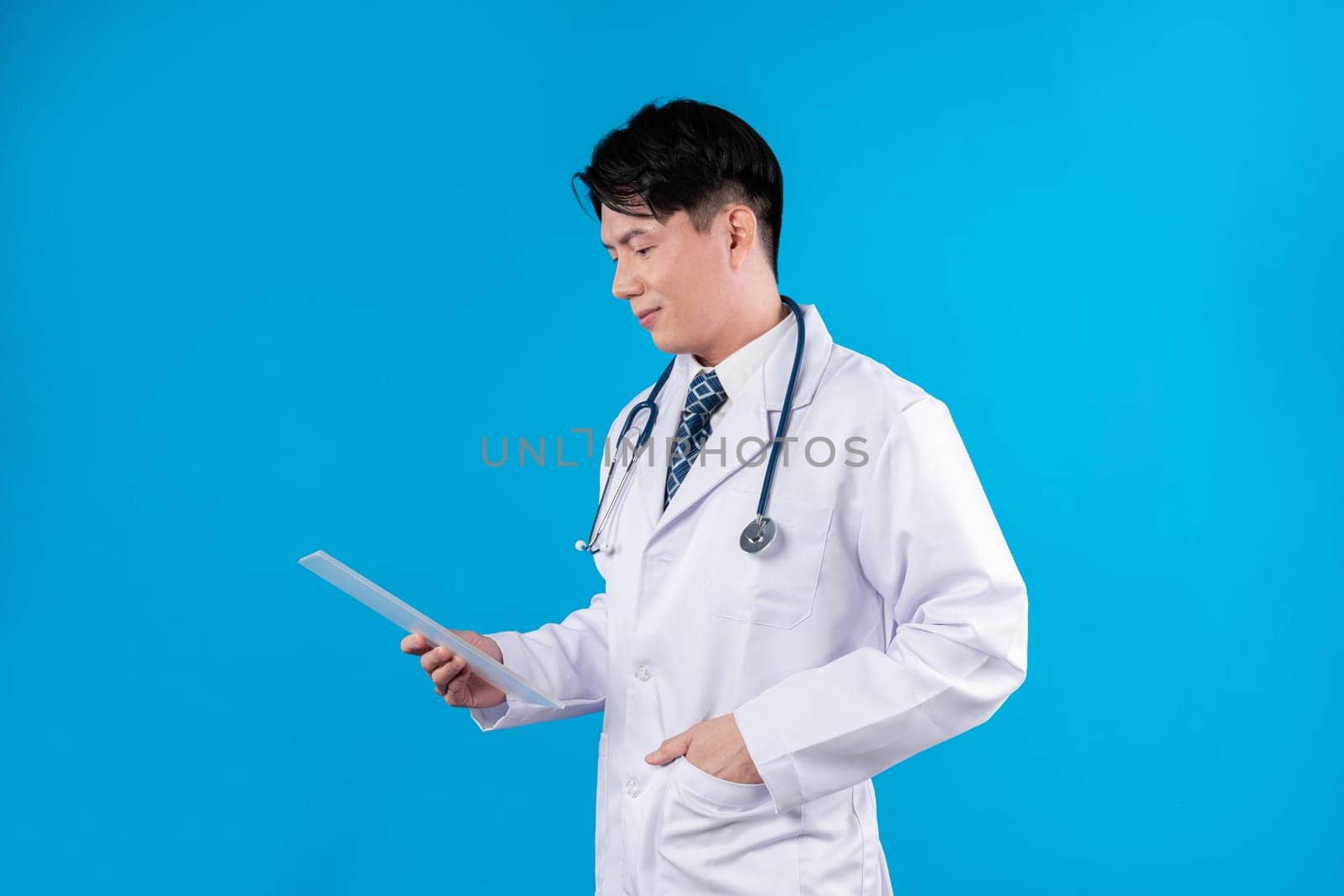 Thinking smart doctor holding transparent tablet searching disease research data futuristic technology analyzing to remedy therapy healthcare innovation interface 3D hologram screen. Contrivance.