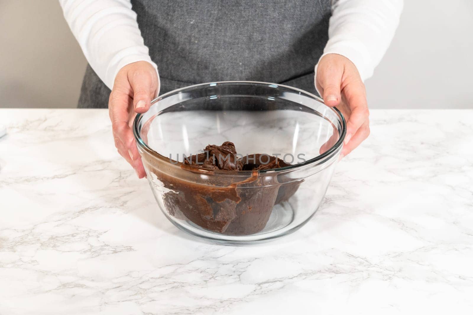 The frosting is whipped to perfection before being piped onto the delicious chocolate cupcakes.